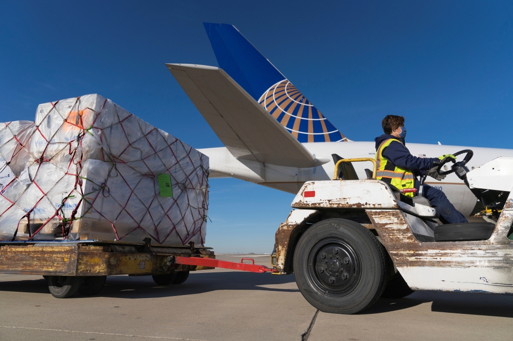 A shipment of Pfizer's coronavirus disease (COVID-19) vaccines is unloaded from a United Airlines cargo-only flight from Brussels to O'Hare International Airport in Chicago, Illinois, U.S. December 2, 2020. United Airlines/Handout via REUTERS