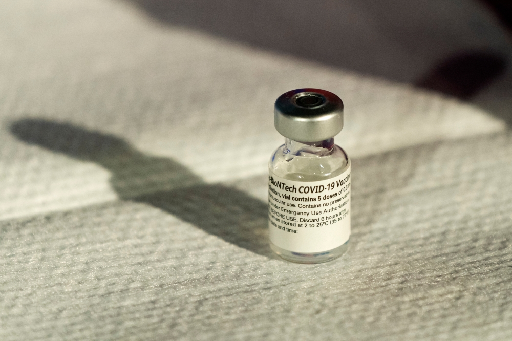 A vial of Pfizer's Covid-19 vaccine that received emergency use authorization is seen at George Washington University Hospital in Washington, DC, US December 14, 2020. Jacquelyn Martin/Pool via Reuters