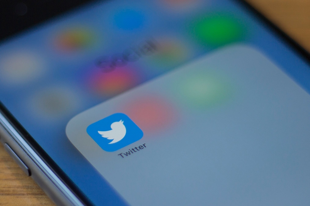 In this file photo taken on July 10, 2019 The Twitter logo is seen on a phone in this photo illustration in Washington, DC. / AFP / Alastair Pike