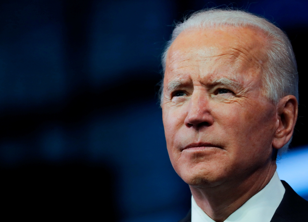 U.S. President-elect Joe Biden pauses as he delivers a televised address to the nation, after the U.S. Electoral College formally confirmed his victory over President Donald Trump in the 2020 U.S. presidential election, from Biden's transition headquarter