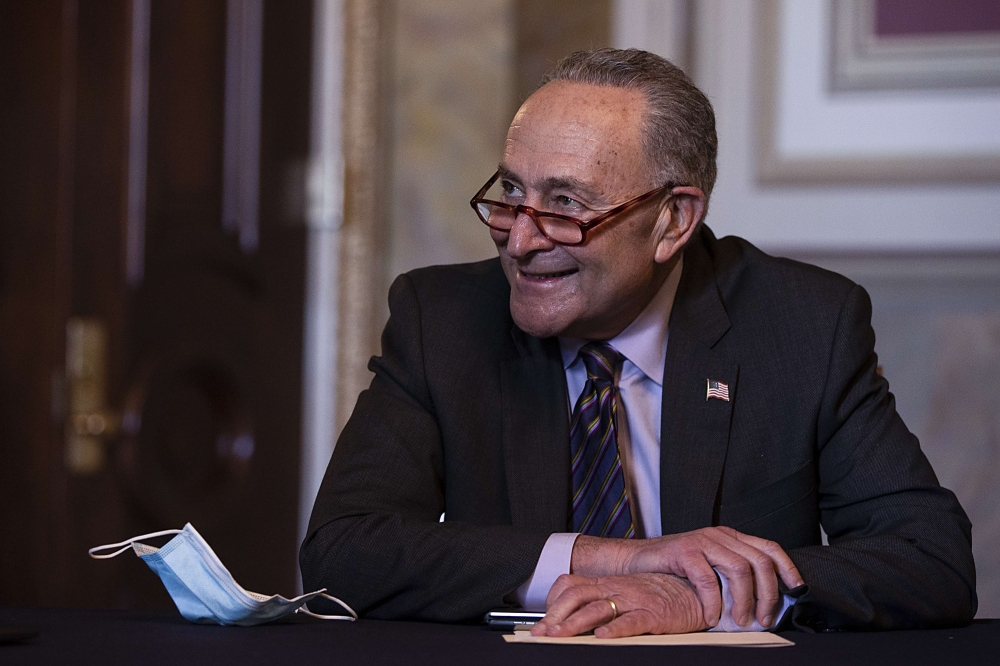 Senate Minority Leader Chuck Schumer (D-NY) meets virtually with incoming Secretary of Housing and Urban Development Marcia Fudge on December 17, 2020 in Washington, DC. Tasos Katopodis/Getty Images/AFP