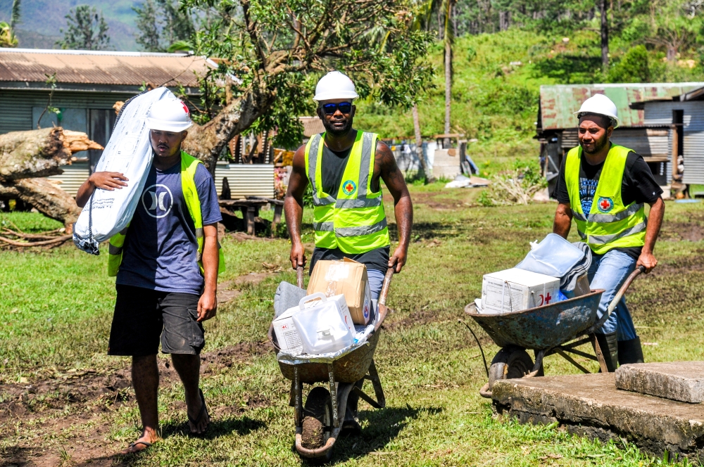 Aid workers bring aid to people who are returning to their houses, completely destroyed by Cyclone Yasa, northern Bua, Vanua Levu, Fiji, December 19, 2020, in this photo supplied by IFRC. Ponipate/IFRC/via Reuters
