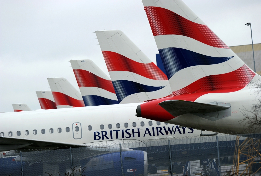 This file picture taken on March 29, 2010 shows British Airways aircraft sitting parked at London Heathrow Airport during the third day of a four-day strike. AFP / Adrian DENNIS