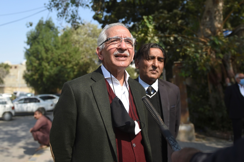Mahmood Sheikh (L), lawyer of British-born militant Ahmed Omar Saeed Sheikh, speaks to media representatives after the high court ordered to release Omar Saeed Sheikh on the murder case of American journalist Daniel Pearl, outside the Sindh high court in 