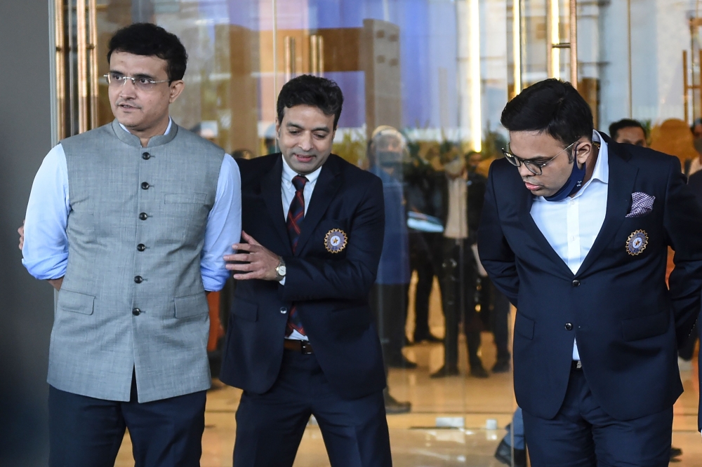 Sourav Ganguly (L), Board of Control for Cricket in India (BCCI) president, Jay Shah, Secretary of the BCCI (R) and Arun Dhumal (C), BCCI treasurer, leave after attending the Annual General Meeting (AGM) of the BCCI at Skyline Taj Hotel on the outskirts o