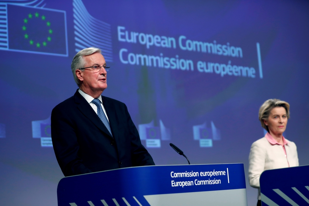 European Union's chief Brexit negotiator Michel Barnier gives a statement on the outcome of the Brexit negotiations next to European Commission President Ursula von der Leyen, in Brussels, Belgium December 24, 2020. Francisco Seco/ via REUTERS
