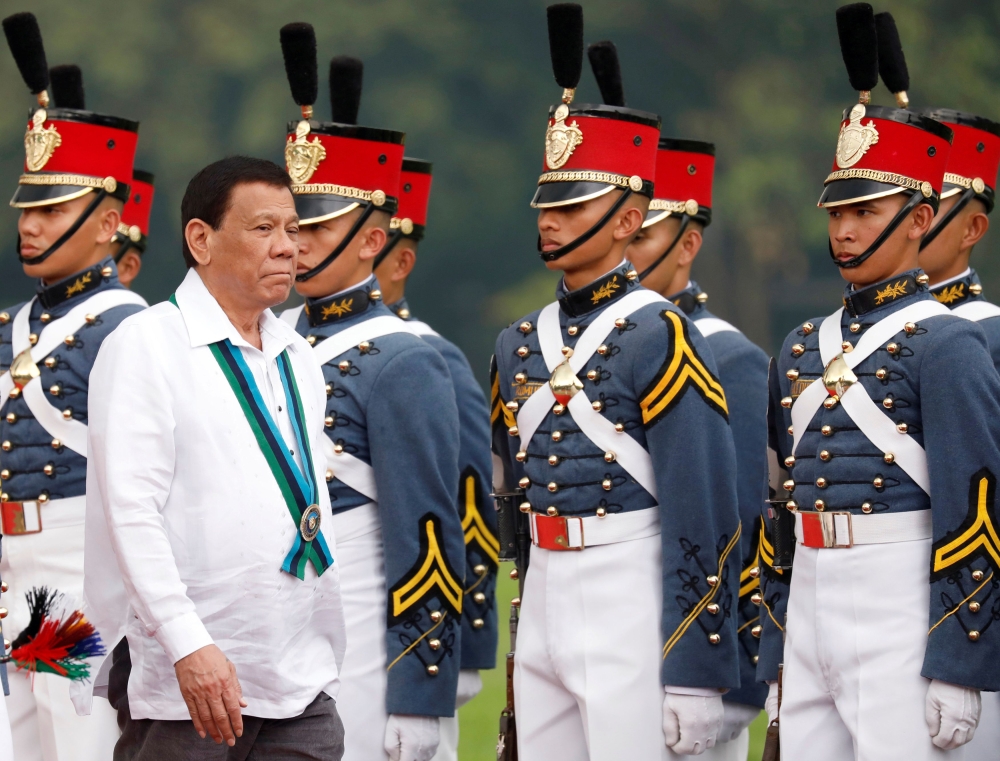 Philippines President Rodrigo Duterte reviews military cadets during change of command ceremonies of the Armed Forces of the Philippines (AFP) at Camp Aguinaldo in Quezon City, metro Manila, Philippines October 26, 2017. REUTERS/Dondi Tawatao/File Photo