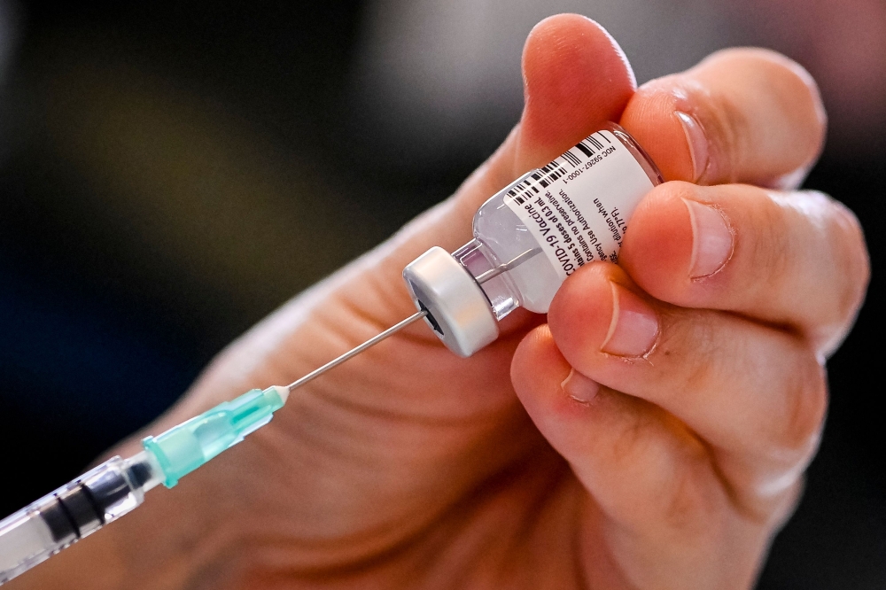 A nurse prepares a dose of the Pfizer-BioNTech Covid-19 vaccine, during a vaccination operation at the 