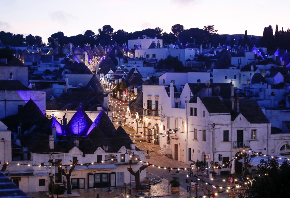 A general view shows an empty street with trulli, limestone buildings of Alberobello, a World Heritage Site, lit up with Christmas lights, as Italy goes back to a complete lockdown during Christmas season as part of efforts to curb the spread of the coron