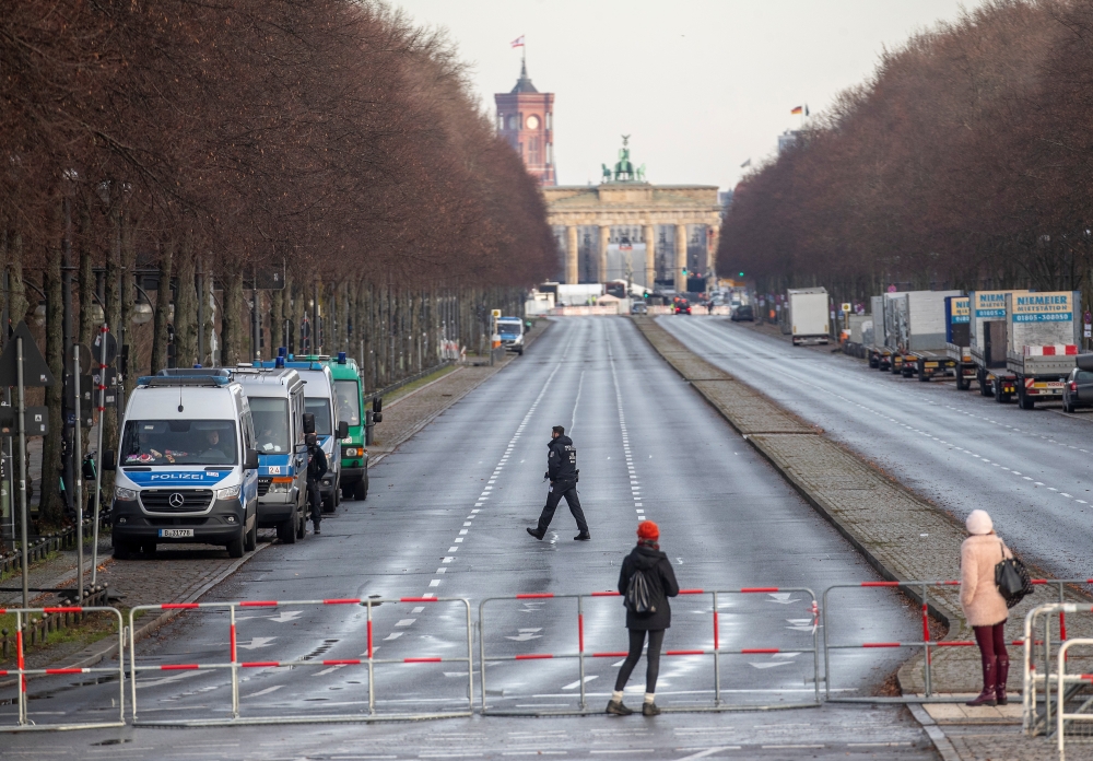 Police officers block the boulevard 'Strasse des 17. Juni' on which the New Year's Eve celebrations with thousands of people have usually taken place in previous years, during the coronavirus disease (COVID-19) outbreak, in Berlin, Germany, December 31, 2
