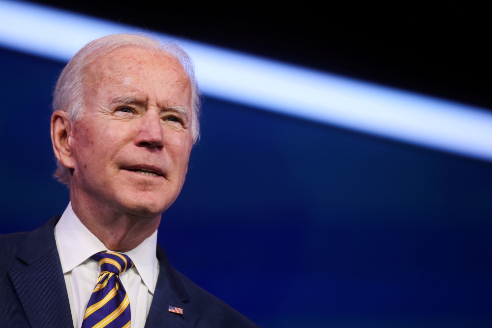 U.S. President-elect Joe Biden delivers remarks on the U.S. response to the coronavirus disease (COVID-19) outbreak, at his transition headquarters in Wilmington, Delaware, U.S., December 29, 2020. REUTERS/Jonathan Ernst/File Photo