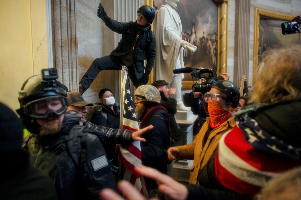 FILE PHOTO: Pro-Trump protesters storm the Capitol Building, January 6. REUTERS/Ahmed Gaber