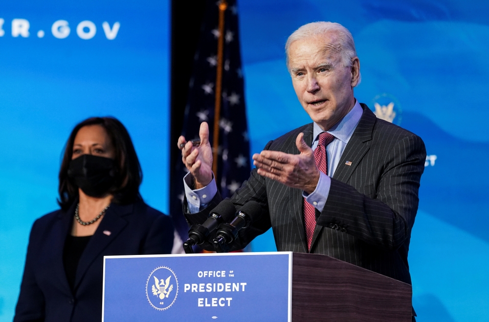 US President-elect Joe Biden speaks next to Vice President-elect Kamala Harris as he announces members of economics and jobs team at his transition headquarters in Wilmington, on January 8, 2021. (Reuters/Kevin Lamarque)