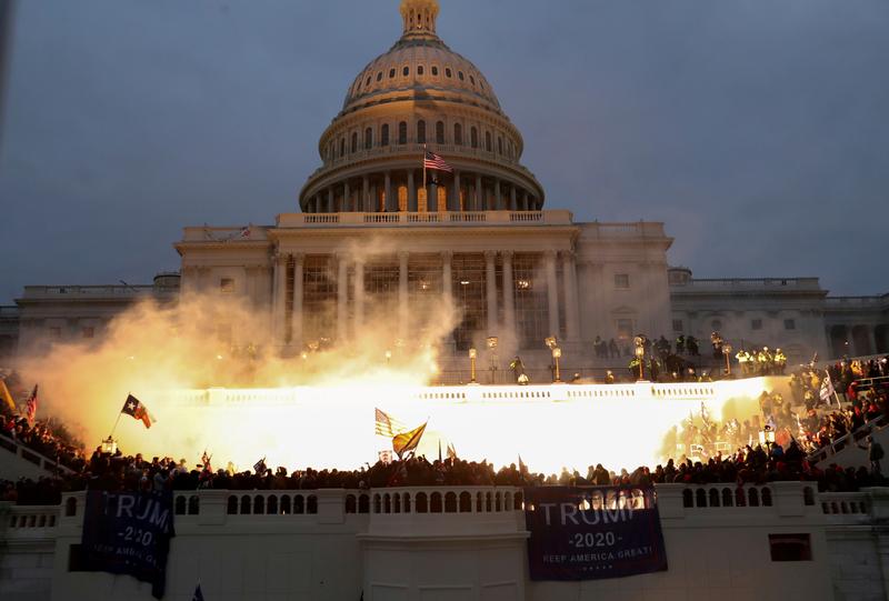An explosion caused by a police munition is seen while supporters of US President Donald Trump gather in front of the US Capitol Building in Washington, US, January 6, 2021. Reuters/Leah Millis
