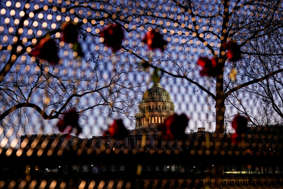 Roses are placed in a security fence at the U.S. capitol as Democratic members of the House prepare an article of impeachment against U.S. President Donald Trump in Washington, U.S., January 12, 2021. REUTERS/Joshua Roberts
