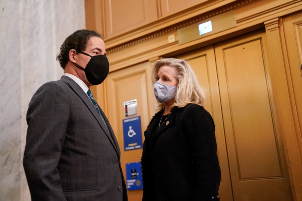 Rep. Jamie Raskin (D-MD) talks with Rep. Liz Cheney (R-WY) in the U.S. Capitol after the House voted on a resolution demanding U.S. Vice President Pence and the cabinet remove President Trump from office, in Washington, U.S., January 12, 2021. Reuters/Eri