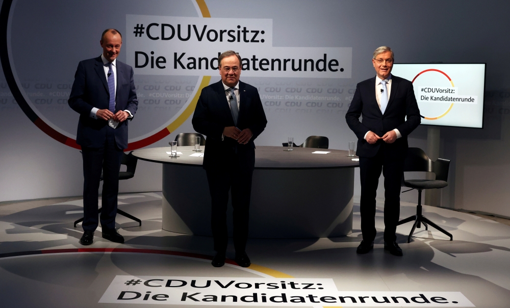 File photo: The three candidates for the chairmanship of Germany's Christian Democratic Union (CDU) party, from left to right, Friedrich Merz, Armin Laschet and Norbert Roettgen, pose at the end of a debate at party headquarters in Berlin, Germany, Januar