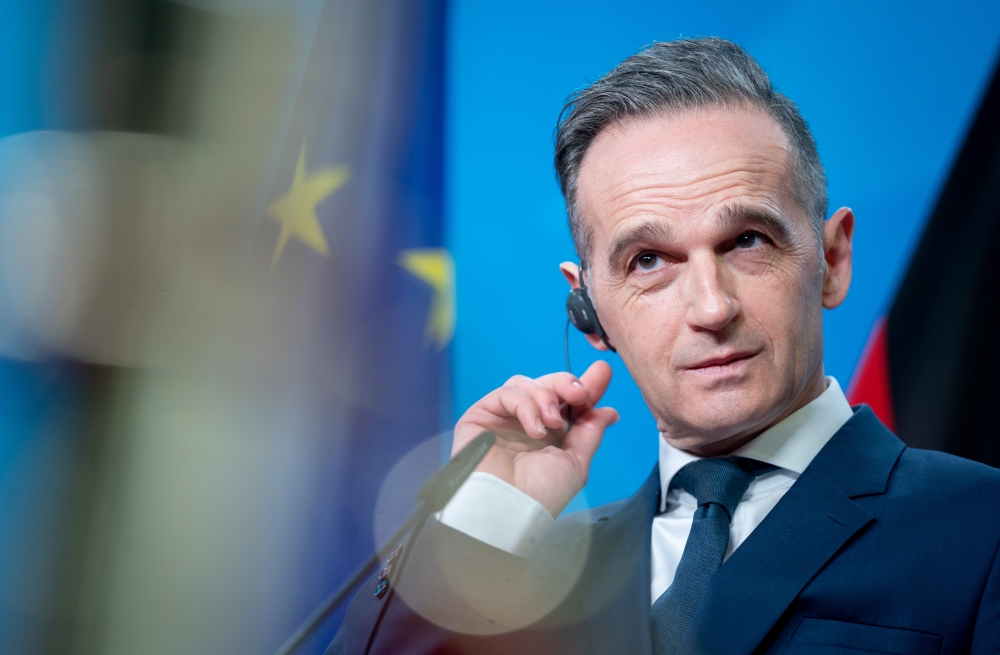 German Foreign Minister Heiko Maas listens to his counterpart Djordje Radulovic of Montenegro during their meeting in Berlin, Germany, January 15, 2021. Kay Nietfeld/Pool via Reuters