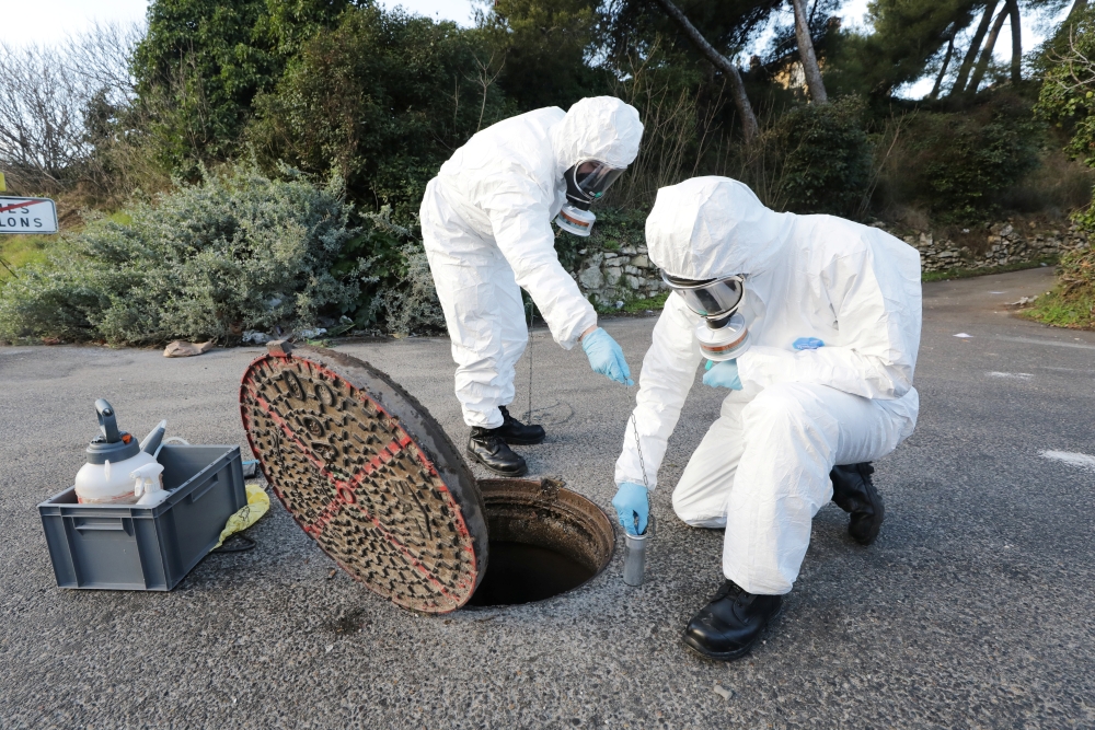 Firefighters from the Marins-Pompiers of Marseille (Marseille Naval Fire Battalion) take samples in Marseille sewage water to detect the concentration of coronavirus traces and the presence of the new UK variant of the virus in Marseille, France, January 