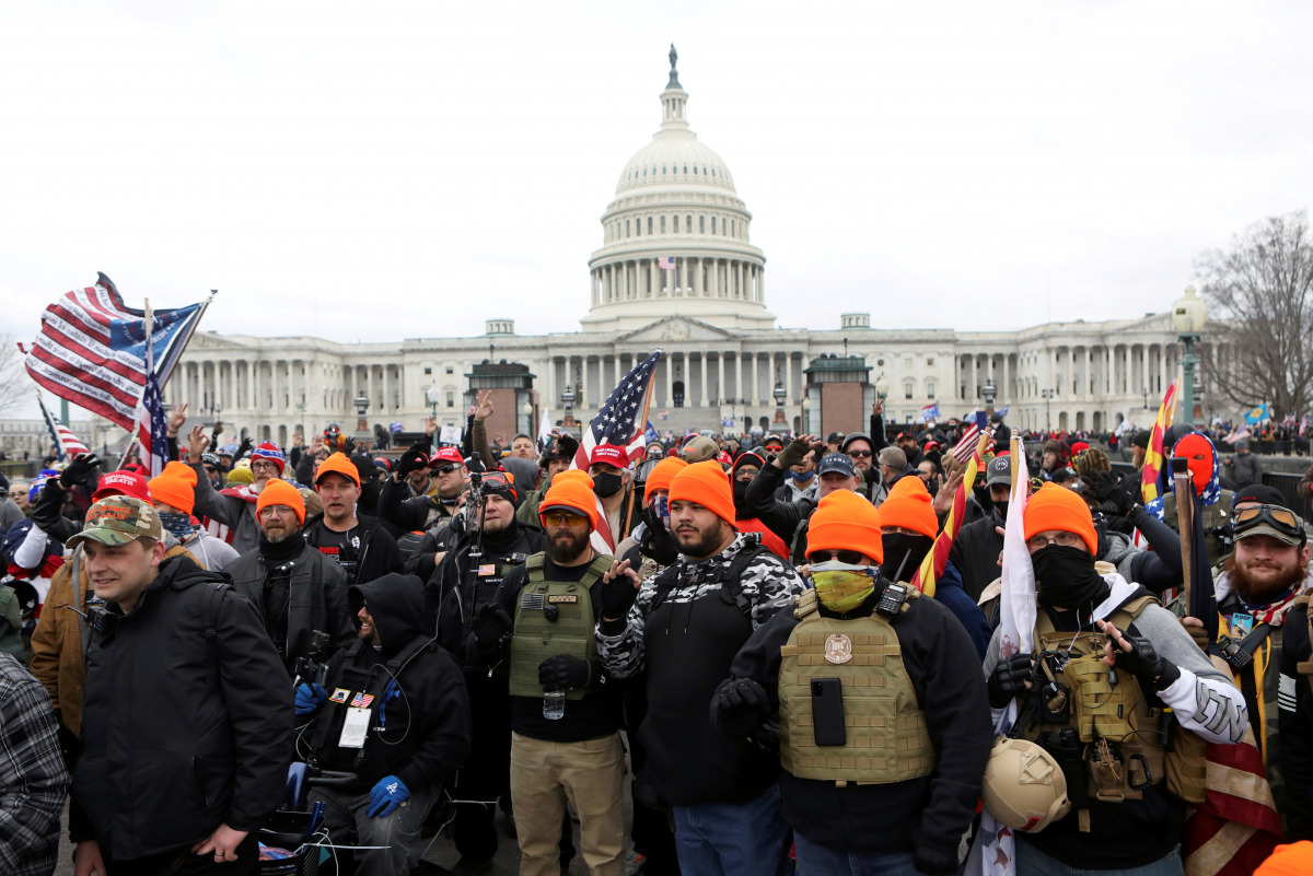 FILE PHOTO: Members of the far-right group Proud Boys make 'OK' hand gestures indicating 