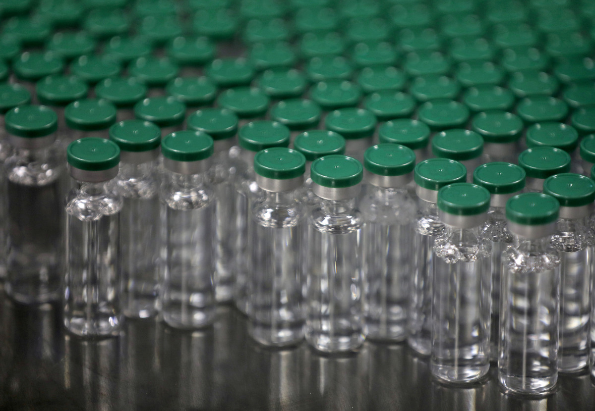 FILE PHOTO: Vials of AstraZeneca's COVISHIELD, coronavirus disease (COVID-19) vaccine, are seen before they are packaged inside a lab at Serum Institute of India, Pune, India, November 30, 2020. REUTERS/Francis Mascarenhas/File Photo
