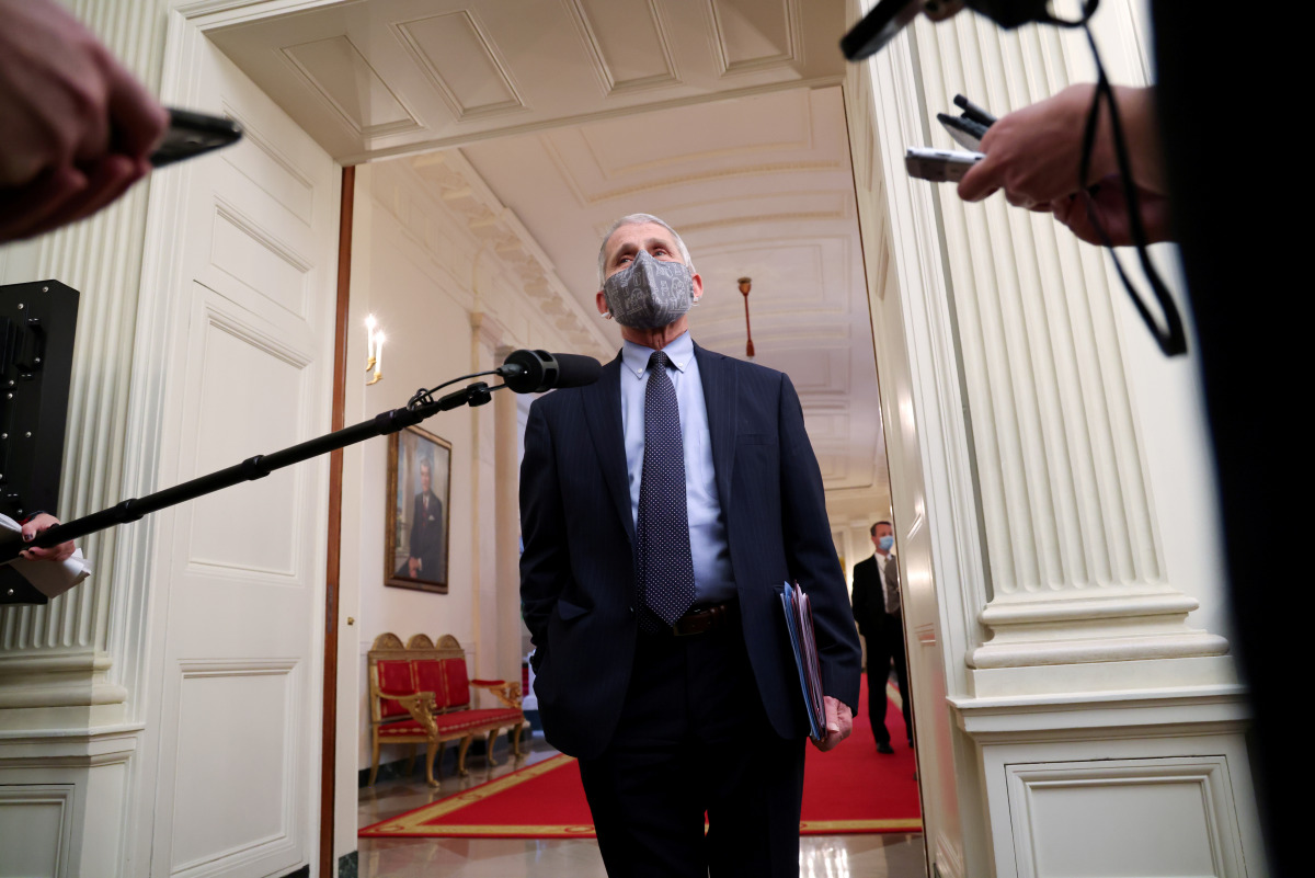 NIH National Institute of Allergy and Infectious Diseases Director Anthony Fauci talks to reporters as he arrives for a COVID-19 response event with U.S. President Joe Biden at the White House in Washington, U.S. January 21, 2021. REUTERS/Jonathan Ernst
