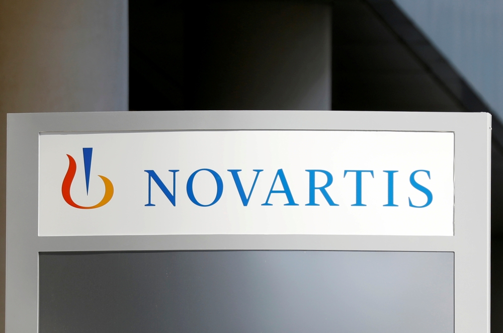 The logo of Swiss drugmaker Novartis is pictured at the French company's headquarters in Rueil-Malmaison near Paris, France, April 22, 2020. REUTERS/Charles Platiau/File Photo GLOBAL BUSINESS WEEK AHEAD