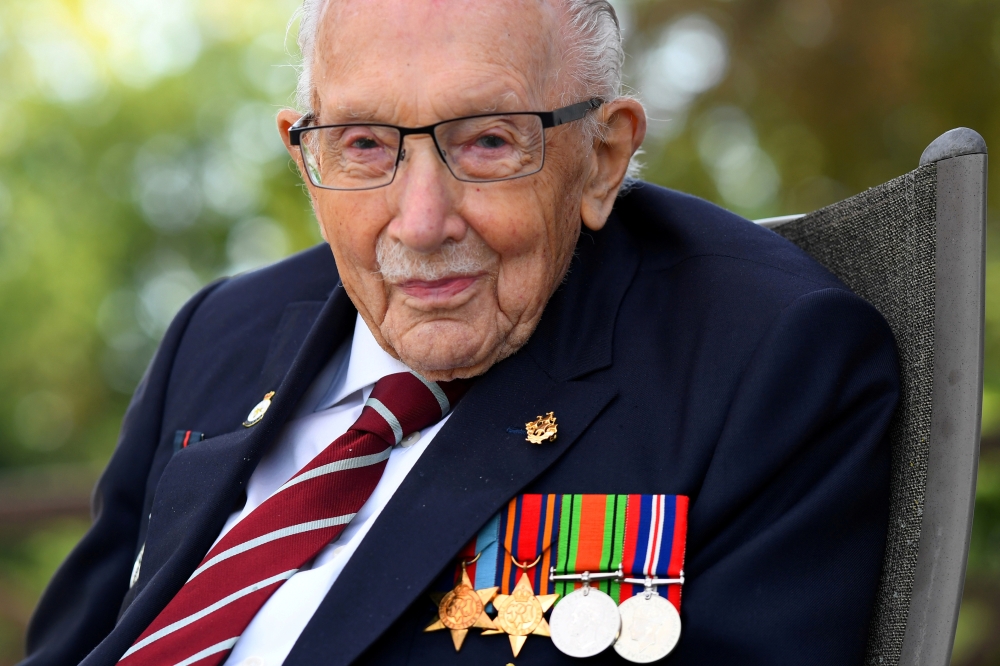 Captain Sir Tom Moore smiles as he launches his autobiography book 'Tomorrow will be a Good Day' at his home in Milton Keynes, Britain September 17, 2020. REUTERS/Dylan Martinez/File Photo
