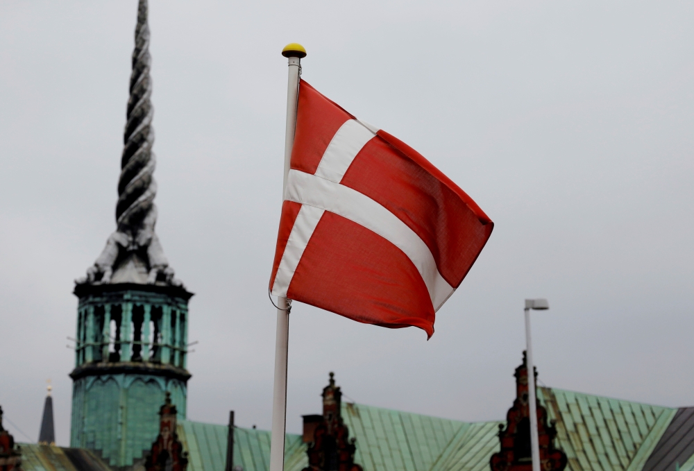 FILE PHOTO: Denmark's national flag flutters in Copenhagen, Denmark, October 22, 2019. REUTERS/Andreas Mortensen