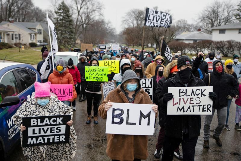 FILE PHOTO: Protesters gather outside of the home where Andre Maurice Hill, 47, was killed in Columbus, Ohio, U.S., December 24, 2020. REUTERS/Megan Jelinger
