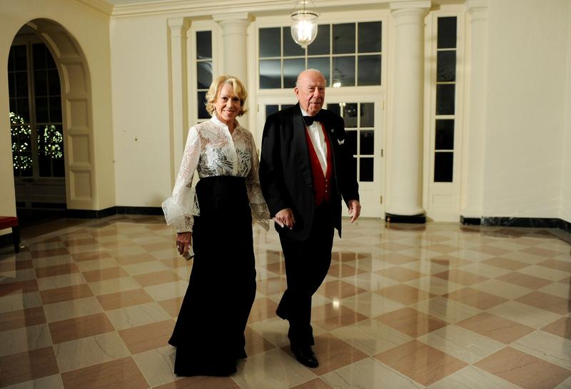 FILE PHOTO: Former U.S. Secretary of State George Shultz arrives with his wife Charlotte for the state dinner hosted by U.S. President Barack Obama and first lady Michelle Obama for President of China Hu Jintao at the White House in Washington, January 19