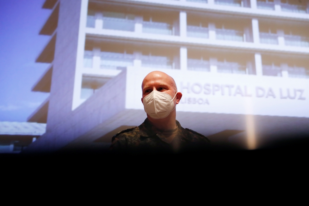 Colonel Dr. Jens-Peter Evers speaks during a news conference on the first day staffing an ICU unit at Hospital da Luz, amid the coronavirus disease (COVID-19) pandemic, in Lisbon, Portugal February 8, 2021. REUTERS/Pedro Nunes