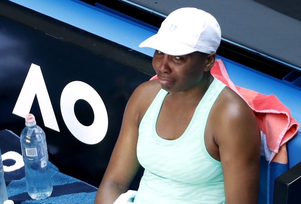 Venus Williams of the U.S. reacts after sustaining an injury during her second round match against Italy's Sara Errani REUTERS/Asanka Brendon Ratnayake
