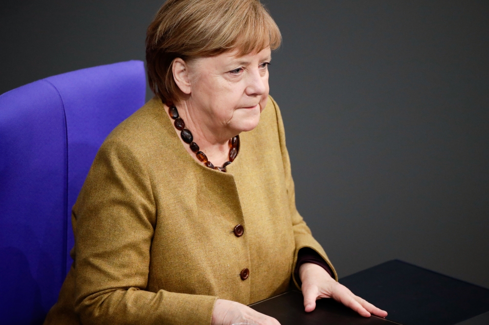 German Chancellor Angela Merkel sits following her speech on the government's response to the coronavirus disease (COVID-19) pandemic, at the country's parliament, the Bundestag, in Berlin, Germany, February 11, 2021. REUTERS/Hannibal Hanschke