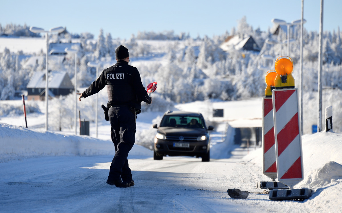 German border police officers stop a car at the border as controls between Germany and the Czech Republic have been re-established, while the spread of the coronavirus disease (COVID-19) continues in Zinnwald, Germany, February 14, 2021. REUTERS/Matthias 