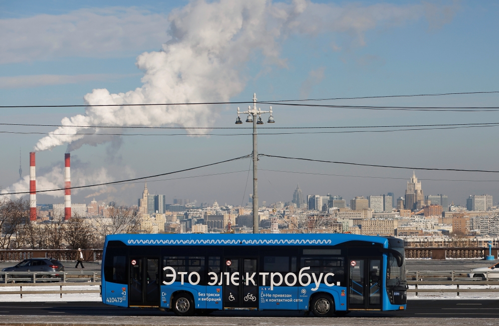 An electric bus travels along a road in Moscow, Russia February 19, 2021. The sign on the bus reads: 
