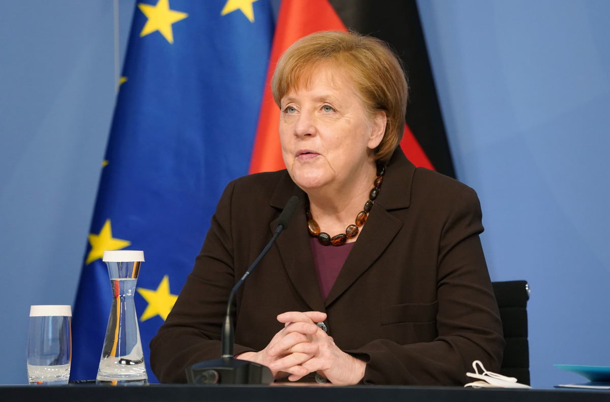 German Chancellor Angela Merkel receives the 2021 report by the Council of Experts on Research and Innovation (EFI), in Berlin, Germany February 24, 2021. Sean Gallup/Pool via REUTERS
