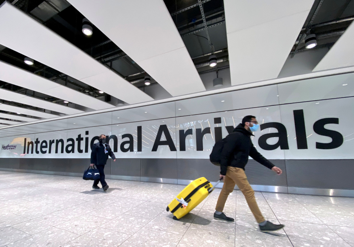 FILE PHOTO: Travellers at Heathrow airport, London, Britain, February 13, 2021. REUTERS/Toby Melville/File Photo
