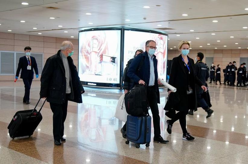 FILE PHOTO: Peter Ben Embarek, and other members of the World Health Organisation (WHO) team tasked with investigating the origins of the coronavirus disease (COVID-19), arrive at the Pudong International Airport in Shanghai, China February 10, 2021. REUT