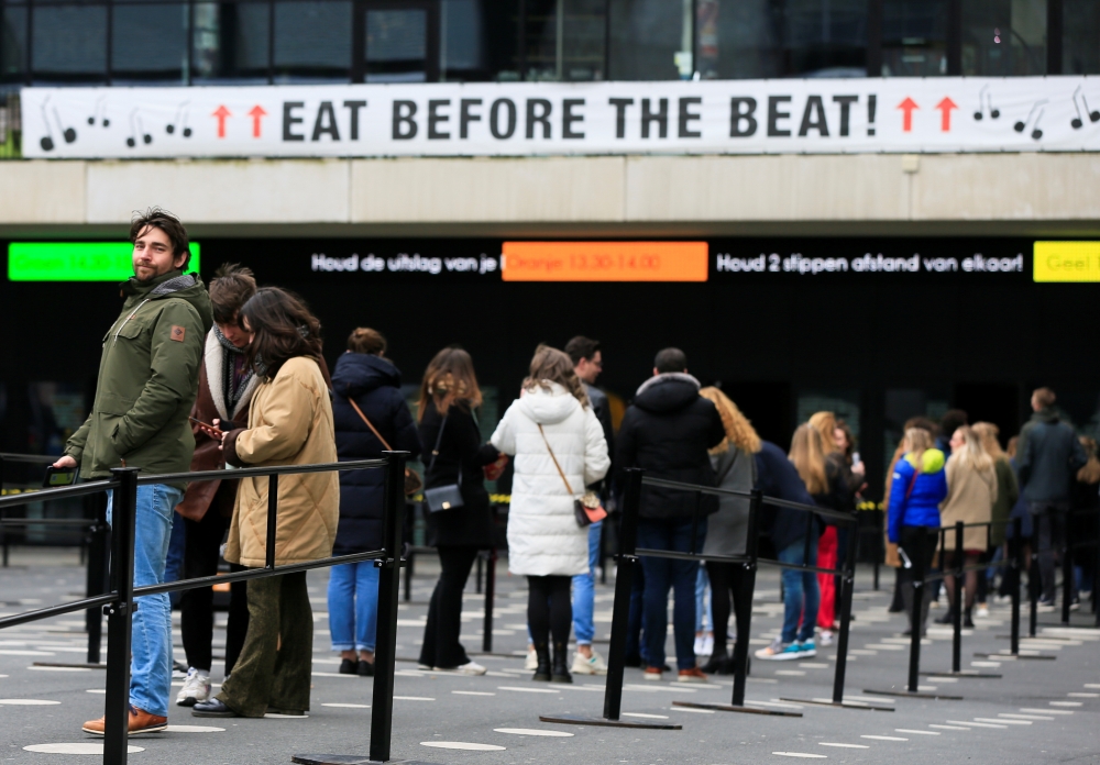 People queue before 