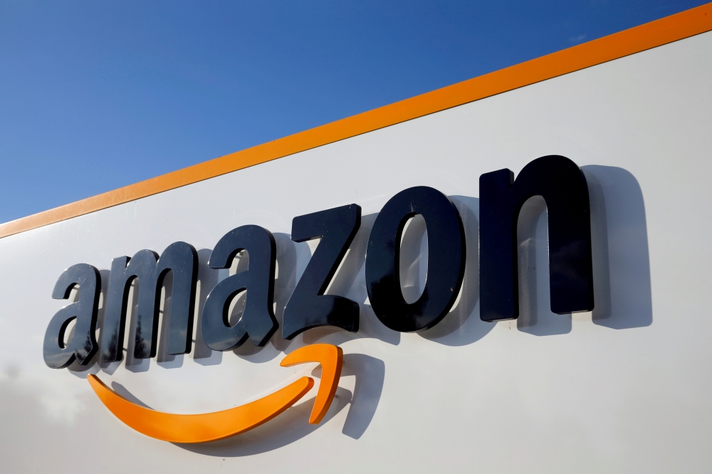 The logo of Amazon is seen at the company logistics centre in Boves, France, August 8, 2018. Reuters/Pascal Rossignol/File Photo