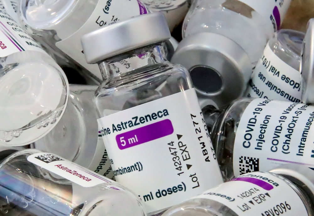 Empty vials of Oxford/AstraZeneca's COVID-19 vaccine are pictured amid a vaccination campaign in Bierset, Belgium March 17, 2021. REUTERS/Yves Herman/File Photo