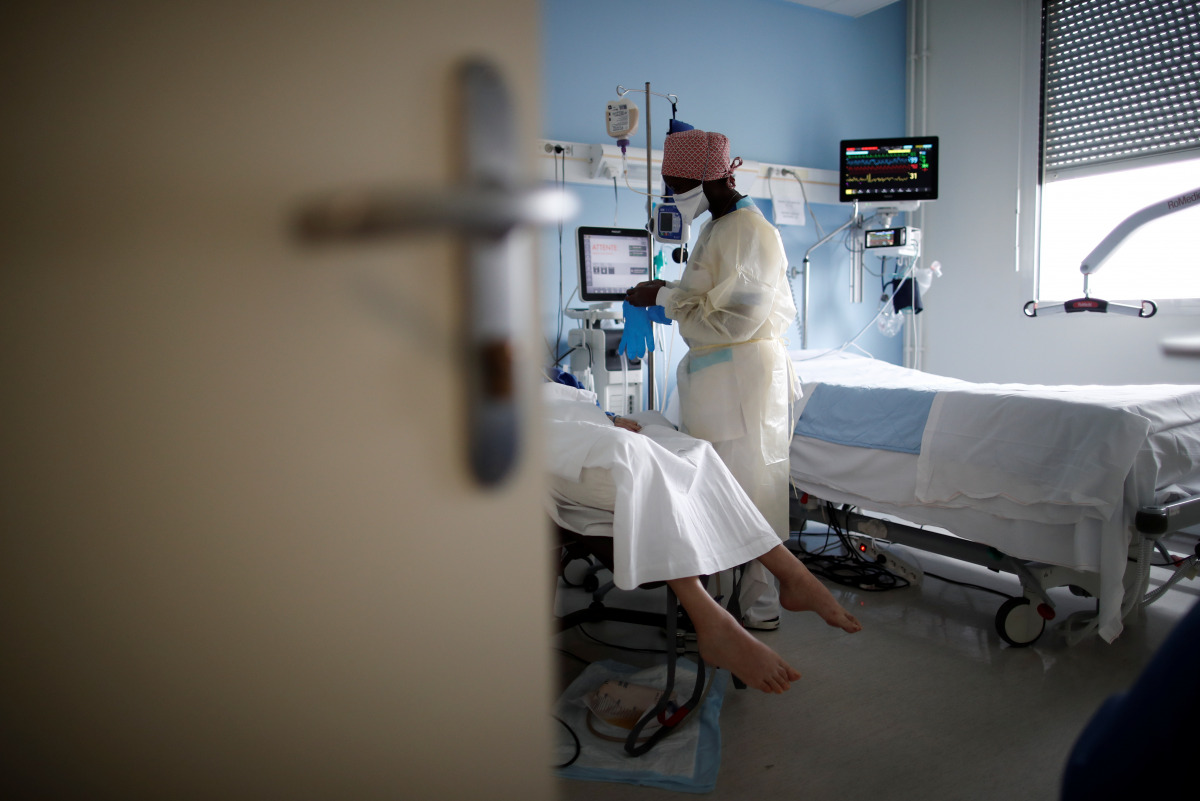 A medical staff member works in the Intensive Care Unit (ICU) where patients suffering from the coronavirus disease (COVID-19) are treated at the Clinique de l'Estree - ELSAN private hospital in Stains, near Paris, France, March 18, 2021. REUTERS/Benoit T