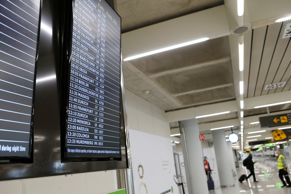 An information board is pictured as tourists from Germany arrive to Palma de Mallorca airport following Berlin's lifted quarantine requirement for travellers returning from the Balearic islands amid the coronavirus disease (COVID-19) pandemic, Palma de Ma