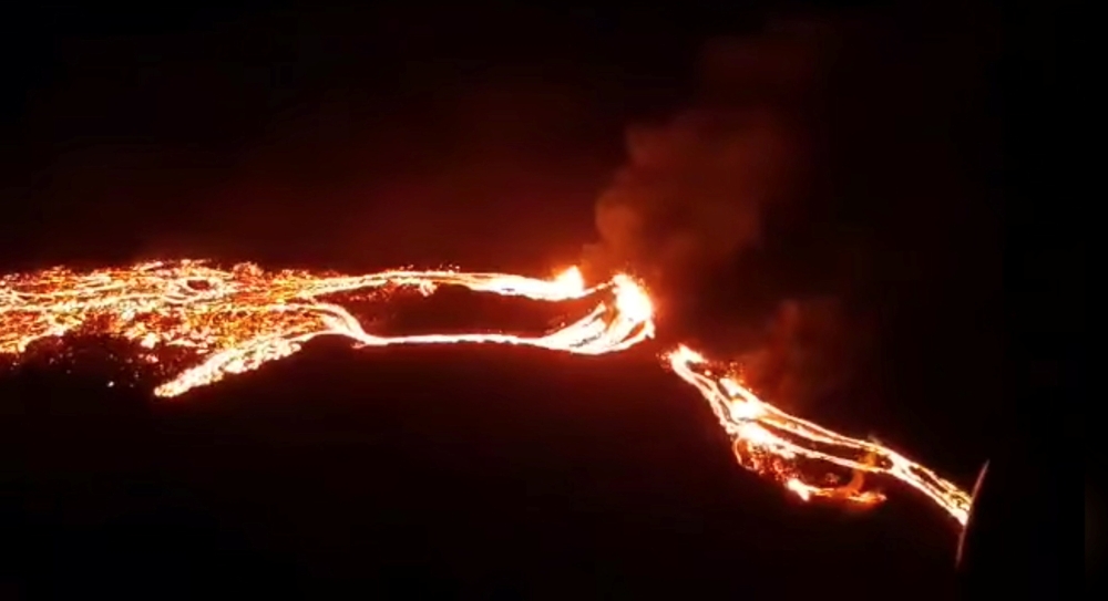 Lava streams are seen during a volcanic eruption in Fagradalsfjall, Reykjanes, Iceland, March 19, 2021 in this still image taken from video provided on social media. Icelandic Meteorological Office via Reuters.