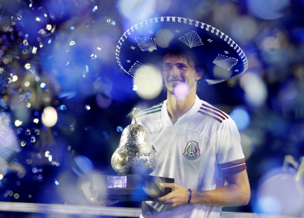 March 20, 2021 Germany's Alexander Zverev celebrates with the trophy after winning the Mexican Open REUTERS/Carlos Perez-Gallardo 