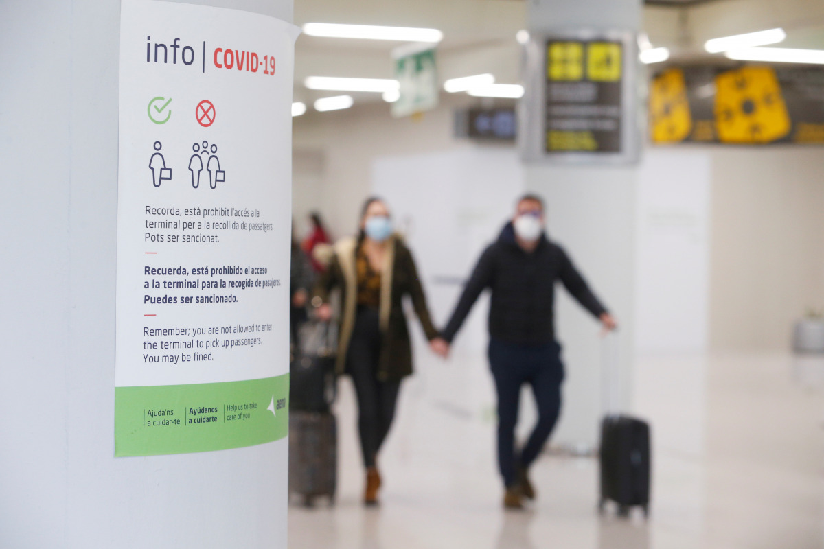 An information placard is pictured as tourists from Germany arrive to Palma de Mallorca airport following Berlin's lifted quarantine requirement for travellers returning from the Balearic islands amid the coronavirus disease (COVID-19) pandemic, Palma de 