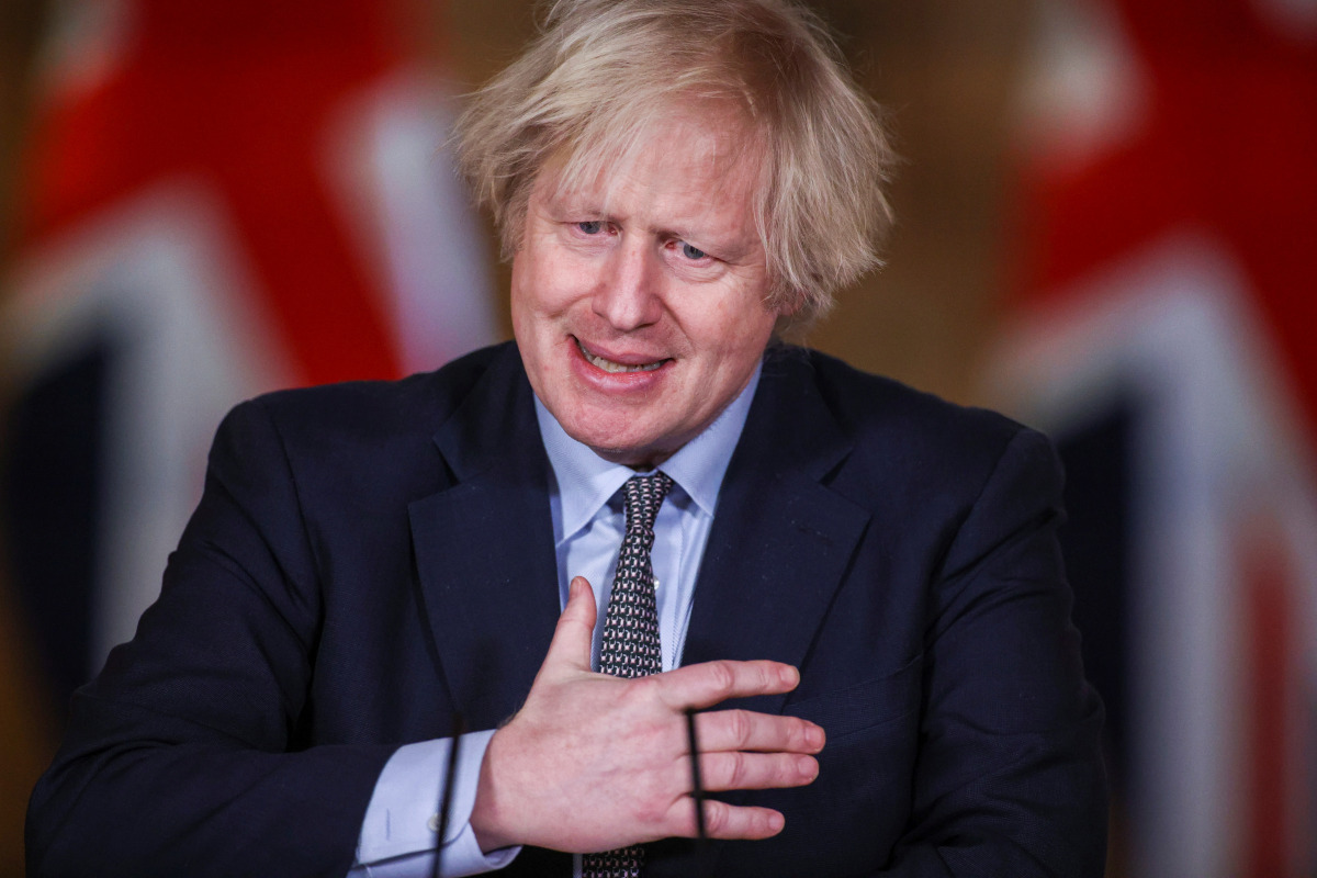 Britain's Prime Minister BORis Johnson gestures as he holds a news conference at 10 Downing Street, on the day of reflection to mark the anniversary of Britain's first coronavirus disease (COVID-19) lockdown, in London, Britain March 23, 2021. REUTERS/Han