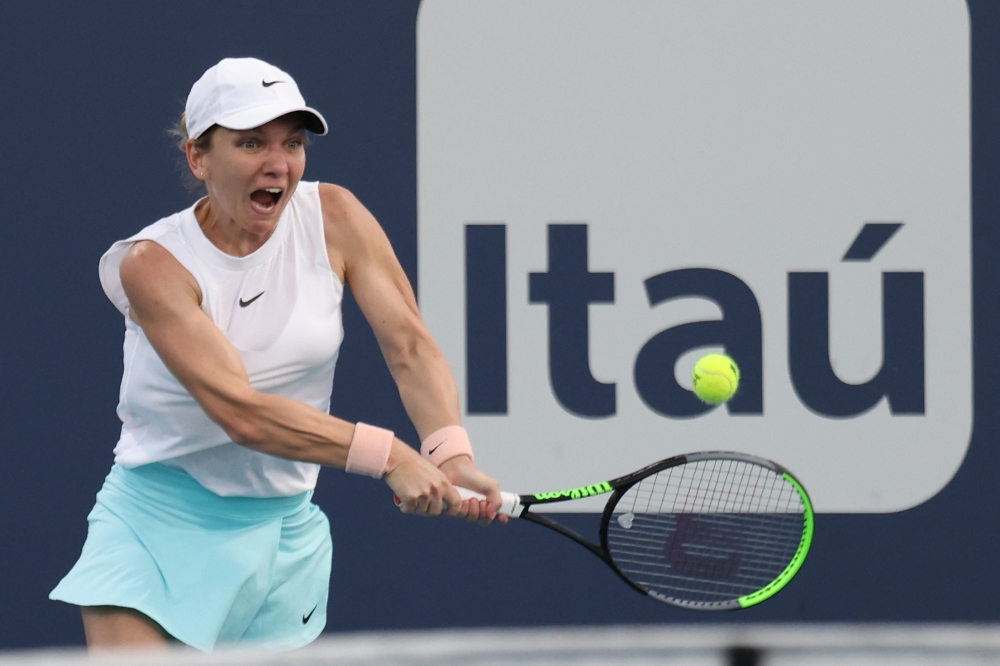 Simona Halep of Romania hits a backhand against Caroline Garcia of France (not pictured) in the second round of the Miami Open at Hard Rock Stadium. Geoff Burke