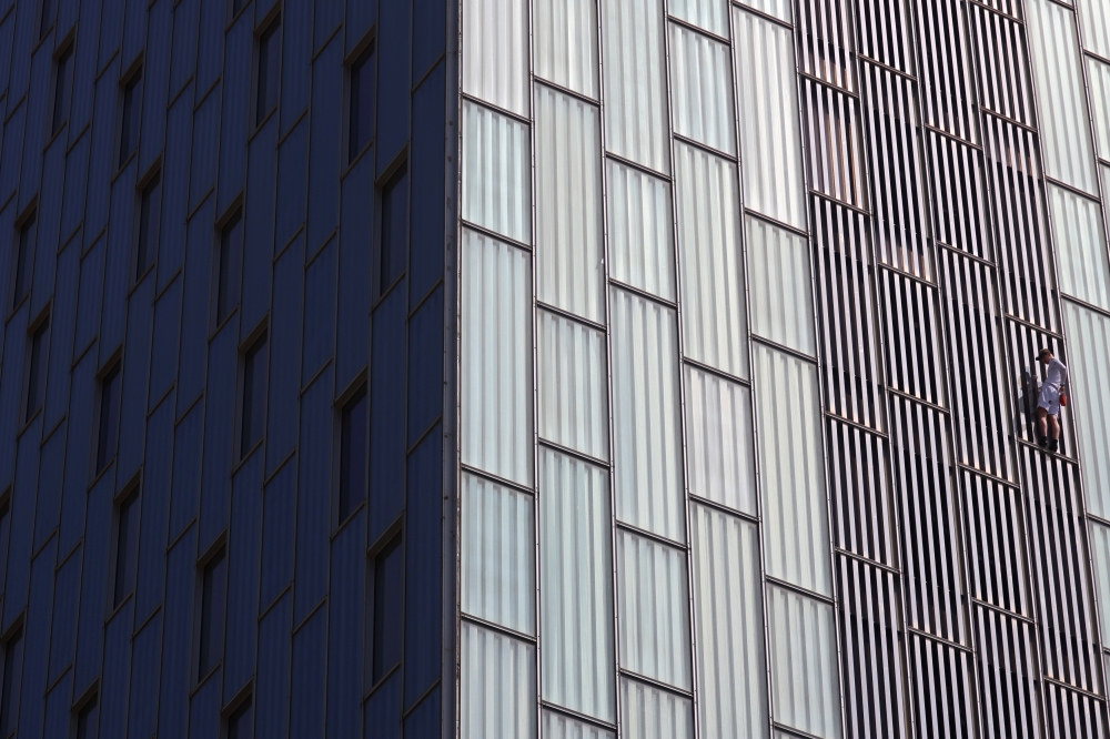 George King, the man who climbed the Shard, climbs the Hotel Melia Barcelona Sky in Barcelona, Spain, April 2, 2021. REUTERS/Nacho Doce